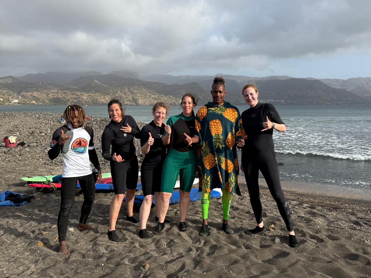 Happy surf students with Kabungo after lesson