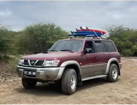 Jeep with surfboards — transport included